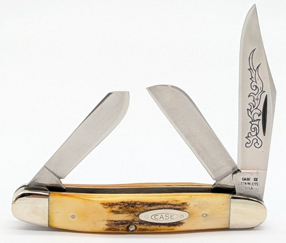 1977 Case XX Blue Scroll Stag Medium Stockman 5347: Knife is in very nice condition with light scuffs on the bolsters from handling. Overall measures 3-7/8in when closed.