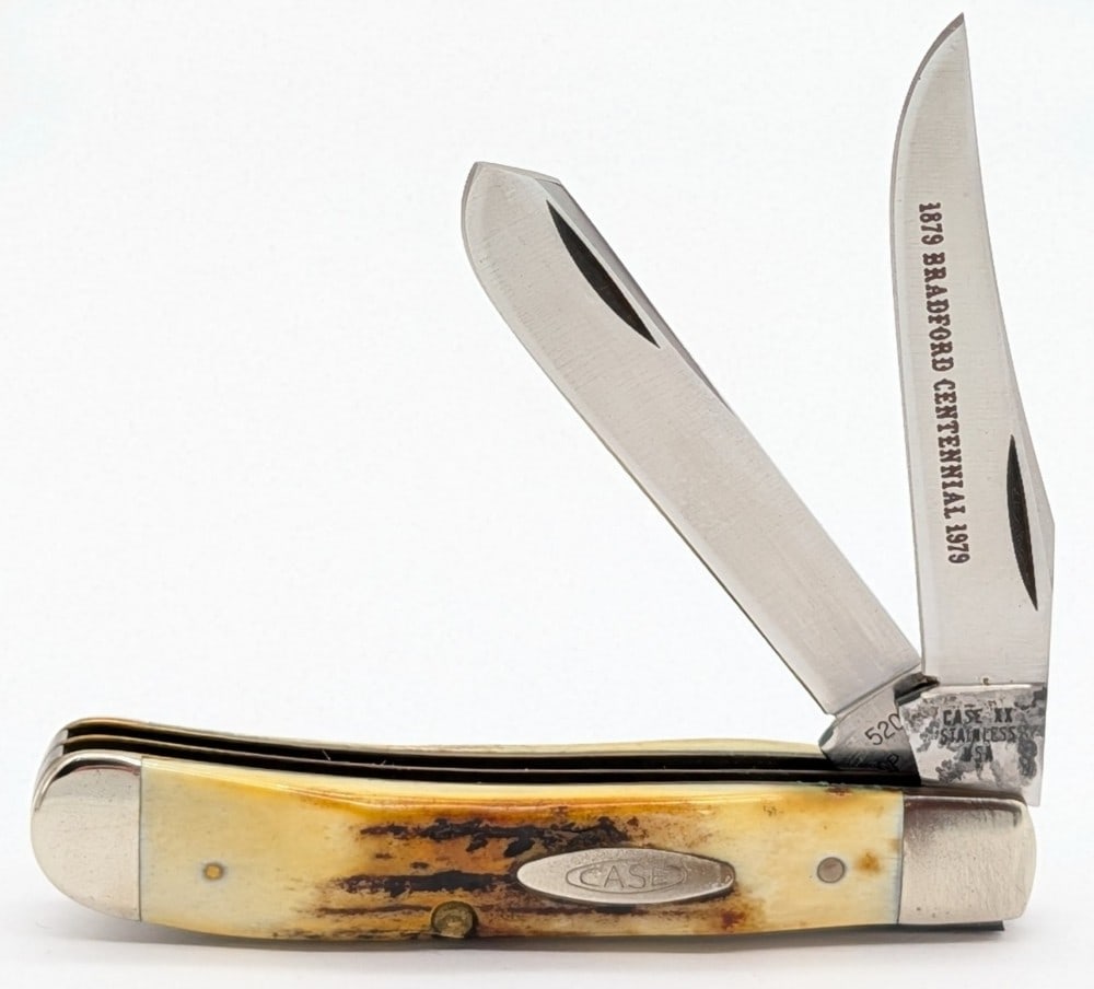 1979 Case XX Bradford Centennial Stag Mini Trapper 5207: Knife is in good condition with some pitting on the tangs of the blades, and scuffs and tarnishing on the bolsters from age and handling. Overall measures 3-1/2in when closed.