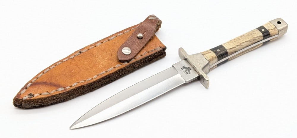 Custom Case XX Mammoth Rehandle Boot Hunter P62-4-1/2: Features custom smooth mammoth handle scales with pinned wood bolster. Knife is in used condition with scratches on the blade, and scratches and dings on the guard. Blade length measures 4-1/2in and o