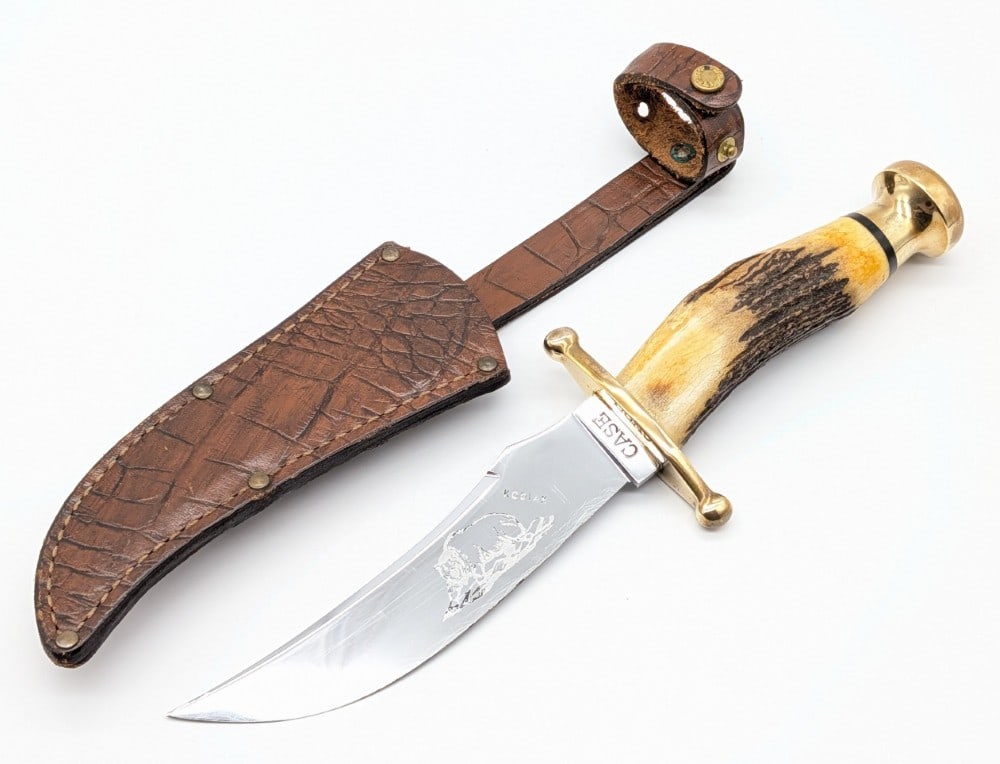 1960s Case XX Stag Kodiak Bear Bowie Knife w/ Sheath: Knife is in good used condition with scratches on the blade, and light scuffs and tarnishing on the guard and pommel. Blade length measures 5-7/8in and overall 10-3/4in.