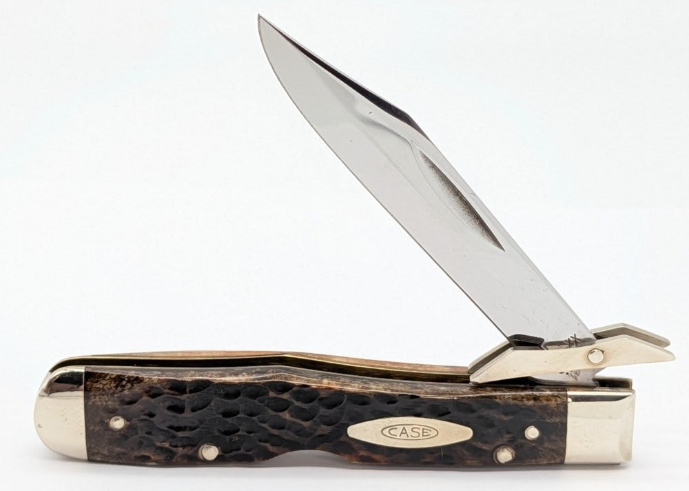 1977 Case XX Jigged Bone Cheetah 6111 1/2: Knife is in very nice condition with an amazing blade finish, and light scuffs and tarnishing on the bolsters from handling. Overall measures 4-3/8in when closed.