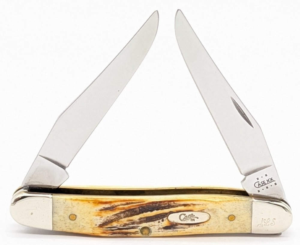 2002 Case XX Stag Muskrat: Knife has personalized engraved initials JLS on the upper front bolster. Knife is in nice condition with some scuffs and tarnishing on the bolsters from handling. Overall measures 3-7/8in when closed.