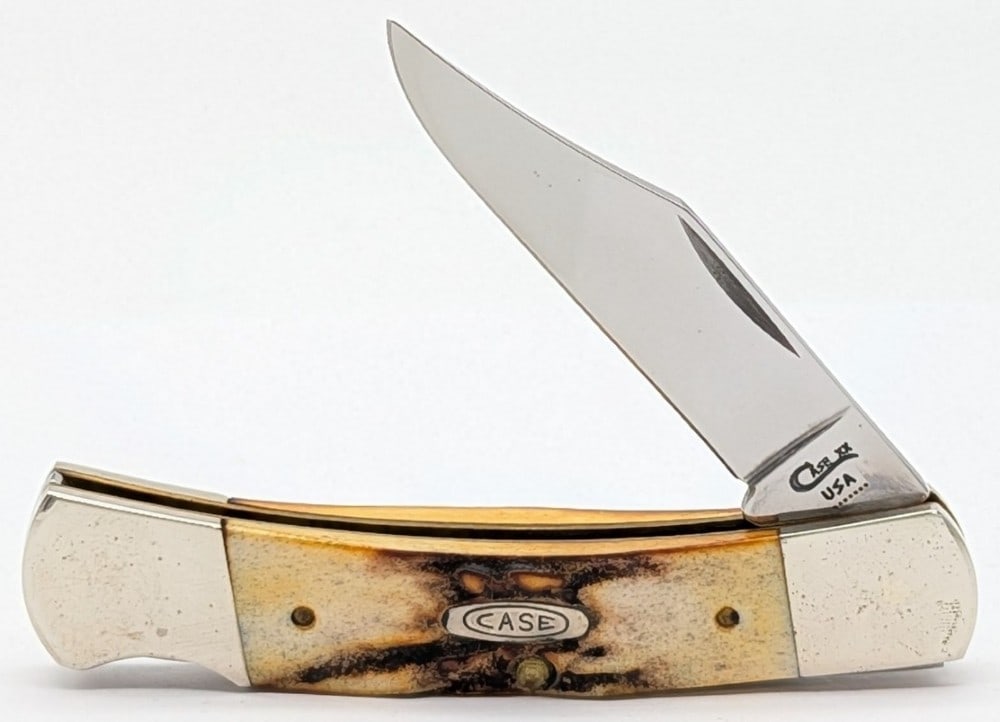 1993 Case XX Stag Small Caliber Lockback Knife 51405L: Knife is in nice condition with some scuffs and tarnishing on the bolsters from handling. Overall measures 3-3/4in when closed.