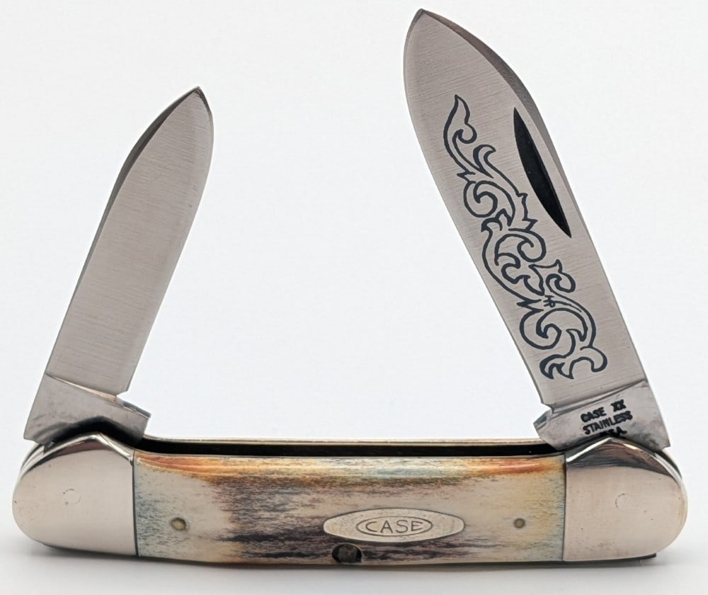 1977 Case XX Blue Scroll Stag Canoe Knife 52131: Knife is in very nice condition with light scuffs from handling. Overall measures 3-5/8in when closed.