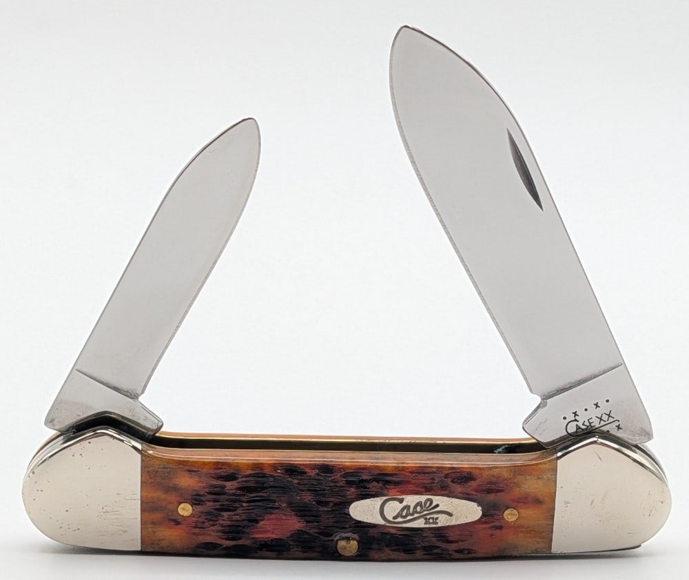 2000 Case XX Autumn Bone Canoe Knife 62131: Knife is in nice condition with light scuffs and tarnishing on the bolsters from handling. Overall measures 3-5/8in when closed.