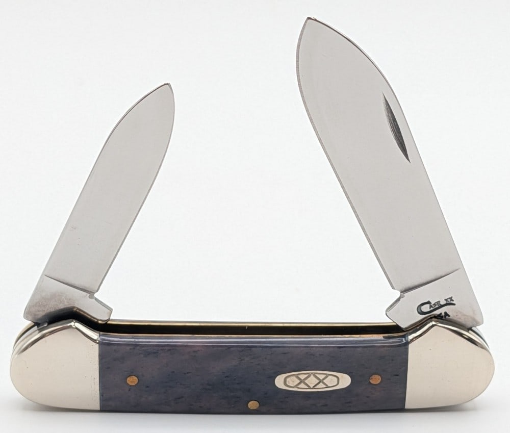 1998 Case XX Smooth Appaloosa Bone Canoe Knife 62131: Knife is in very nice condition with light scuffs and tarnishing on the bolsters from handling. Overall measures 3-5/8in when closed.