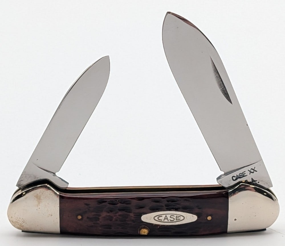 1972 Case XX Red Bone Canoe Knife 62131: Knife is in very nice condition with light scuffs on the bolsters from handling. Overall measures 3-5/8in when closed.