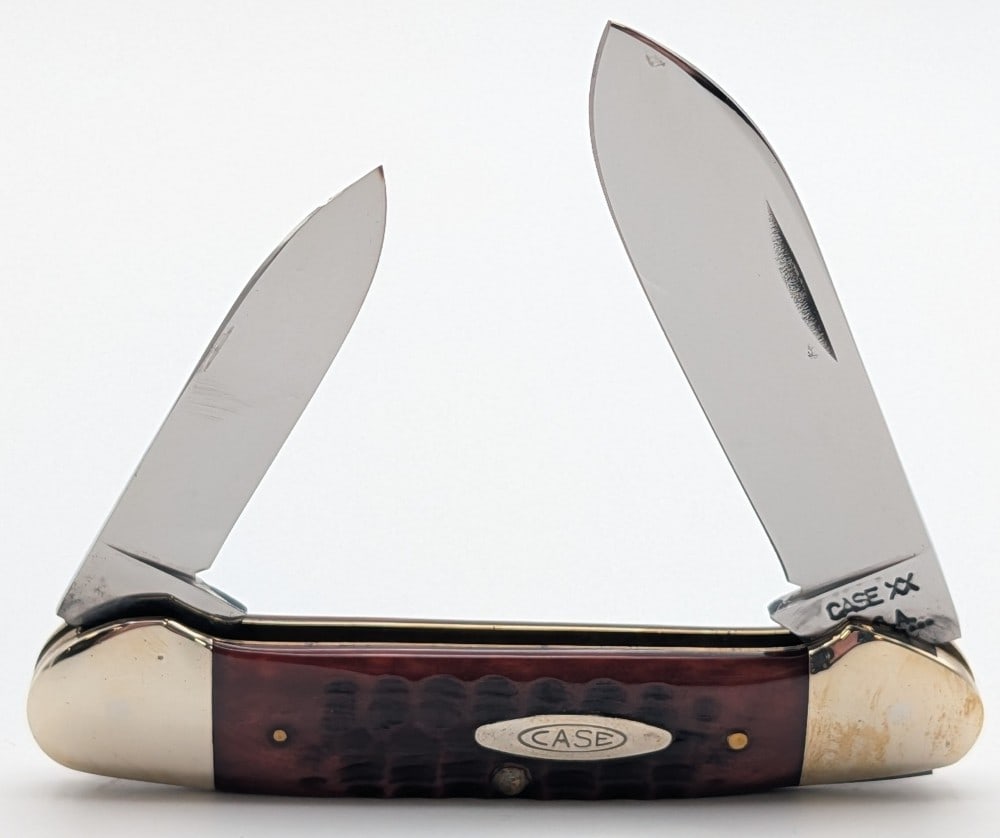 1971 Case XX Red Bone Canoe Knife 62131: Knife is in very nice condition with light scuffs on the bolsters from handling. Overall measures 3-5/8in when closed.