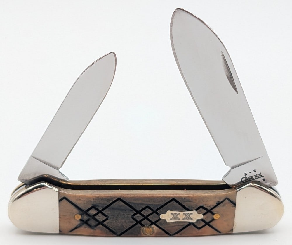 2003 Case XX Diamond Jigged Bone Canoe Knife 62131: Knife is in very nice condition with light scuffs on the bolsters from handling. Overall measures 3-5/8in when closed.