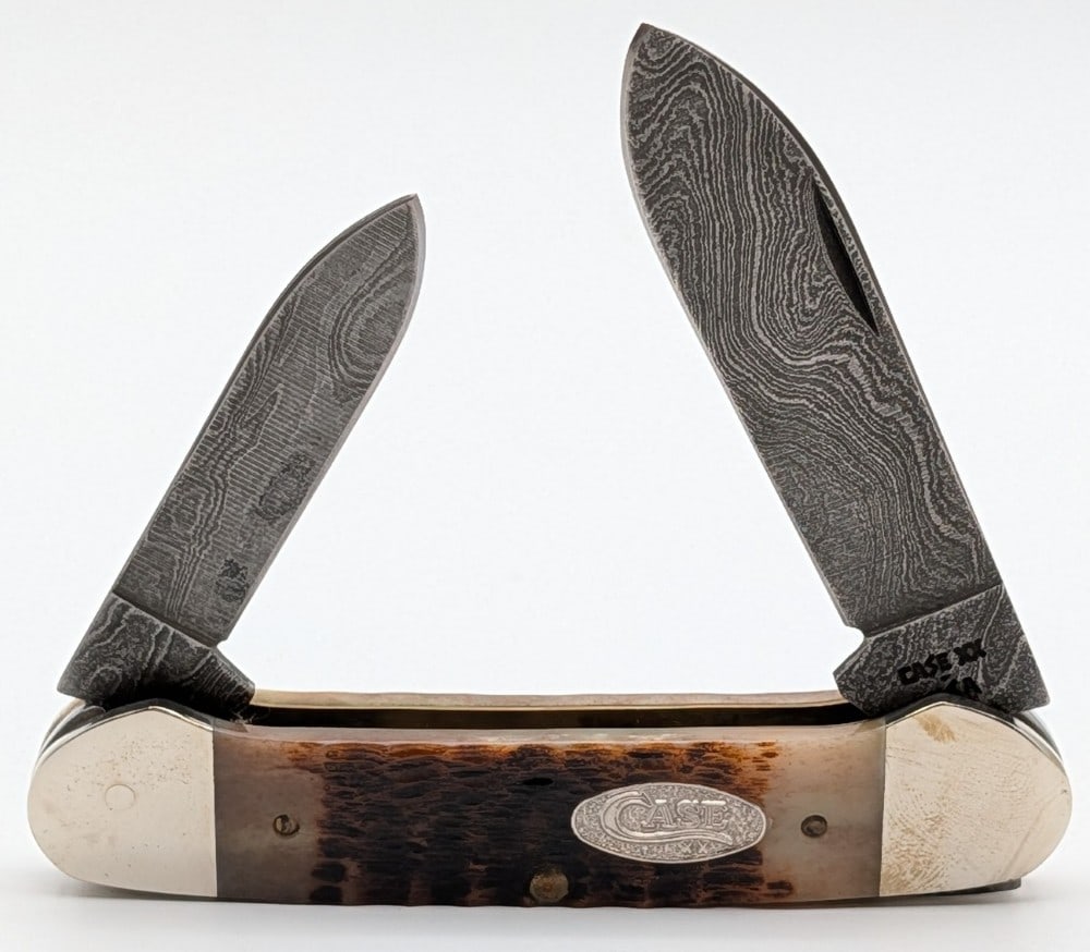 1989 Case XX Rogers Bone Damascus Canoe Knife ROG62131: Knife is in very nice condition with light scuffs from handling. Overall measures 3-5/8in when closed.