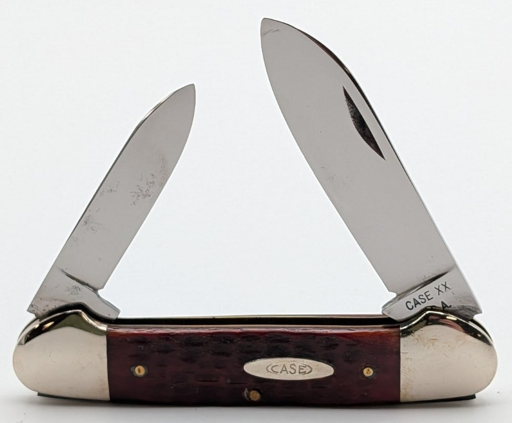 1965-69 Case XX Red Bone Canoe Knife 62131: Knife is in very nice cleaned condition with light material loss and scratches on the polished blades, and light scuffs and some dings on the bolsters from handling and age. Overall measures 3-5/8in w