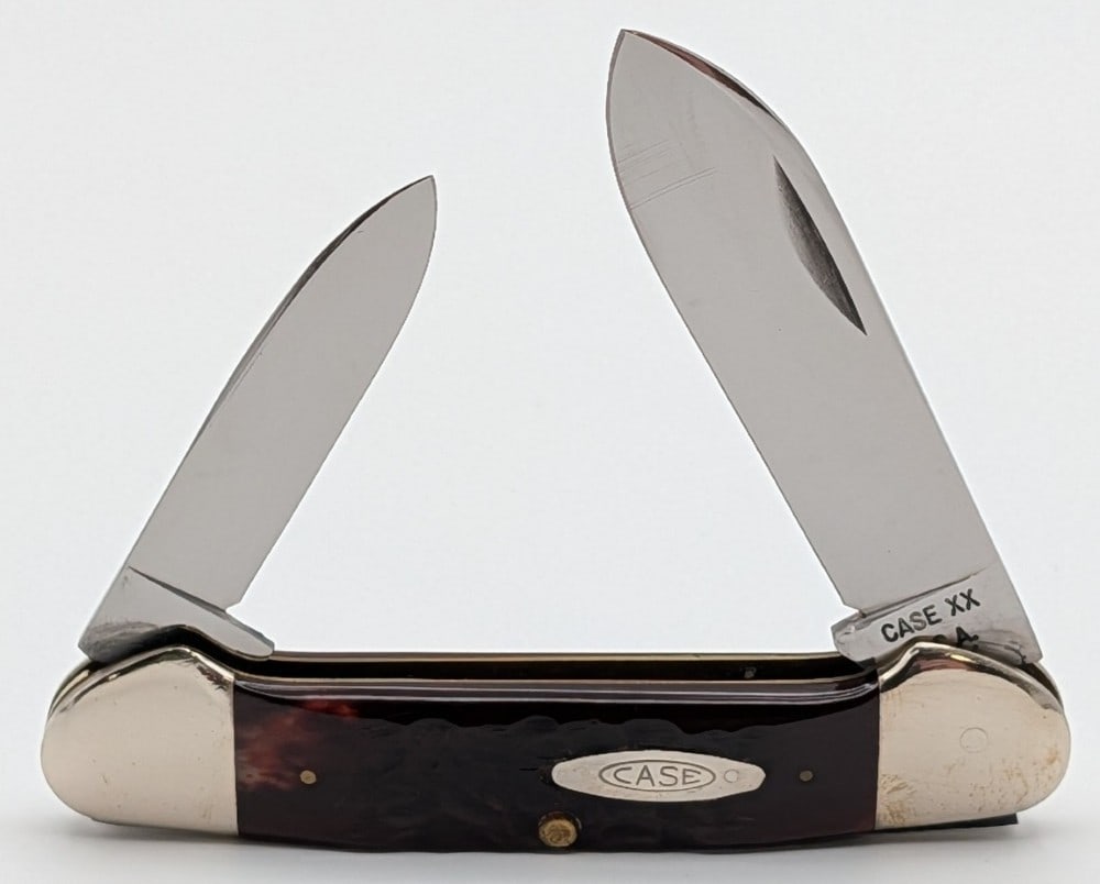 1973 Case XX Red Bone Canoe Knife 62131: Knife is in very nice condition with light scuffs on the bolsters from handling. Overall measures 3-5/8in when closed.