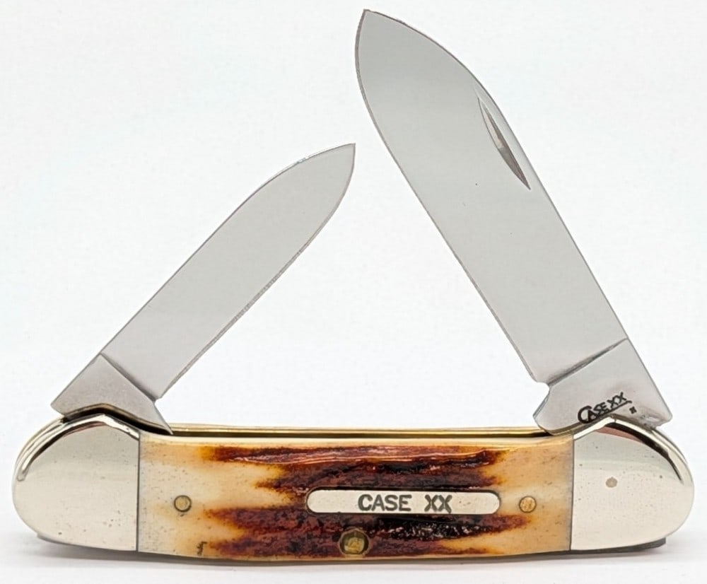 2008 Case XX Red Stag Canoe Knife R52131: Knife is in very nice condition with light scuffs and tarnishing on the bolsters from handling. Overall measures 3-5/8in when closed.
