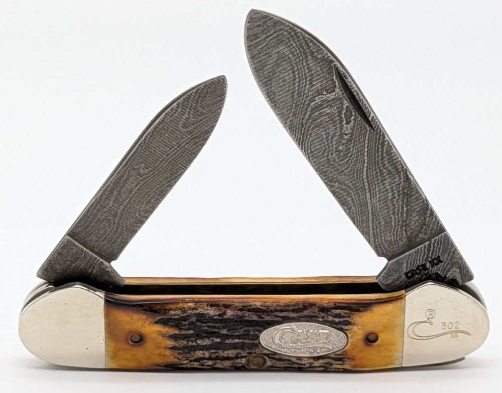 Ltd 1989 Case XX Stag Damascus Canoe Knife 52131: Knife is numbered 302, and is in very nice condition with light scuffs on the bolsters from handling. Overall measures 3-5/8in when closed.