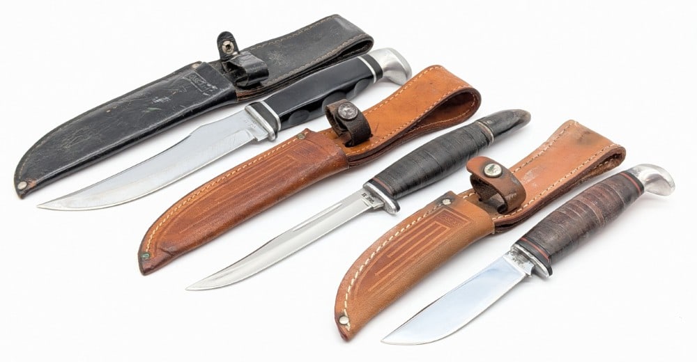 (3) 1940-65 Case XX Hunting Knives w/ Sheaths: Includes the 366, 223-6, and 316-5. Knives are in used aged condition with different amounts of scratches, rusting, and other wear from use and age. Largest blade length measures 5-3/4in and overall 1