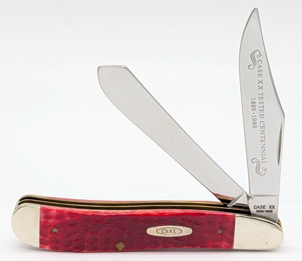 1989 Case XX Centennial Red Bone Dogleg Jack Knife R6240: Knife is in very nice condition with light scuffs on the bolsters from handling. Overall measures 4-1/2in when closed.