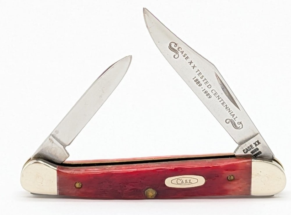 1989 Case XX Centennial Red Bone Mini Copperhead R62109X: Knife is in very nice condition with light scuffs on the bolsters from handling. Overall measures 3-1/8in when closed.