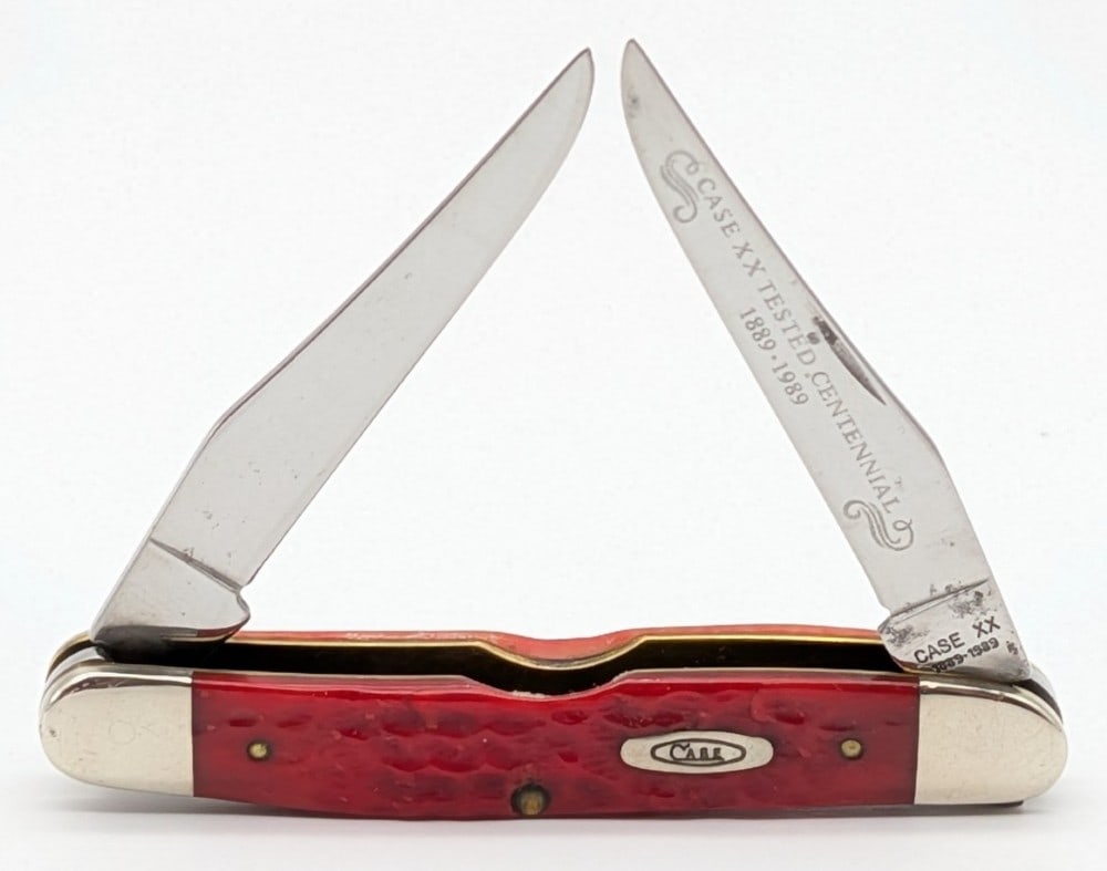 1989 Case XX Centennial Red Bone Muskrat: Knife is in used condition with scratches and wear on the blades, and scuffs and scratches on the bolsters from use and handling. Overall measures 3-7/8in when closed.