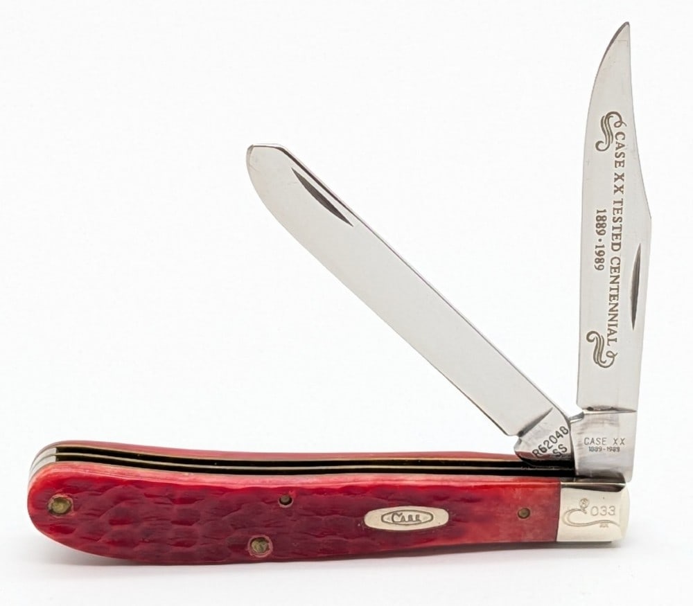 Ltd 1989 Case XX Centennial Red Bone Slimline Trapper R62040: Knife is numbered 033, and is in very nice condition with light scuffs on the bolsters from handling. Overall measures 4-1/8in when closed.