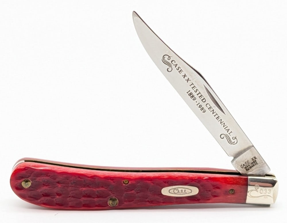 Ltd 1989 Case XX Centennial Red Bone Slimline Trapper R61048: Knife is numbered 033, and is in very nice condition with light scuffs on the bolsters from handling. Overall measures 4-1/8in when closed.