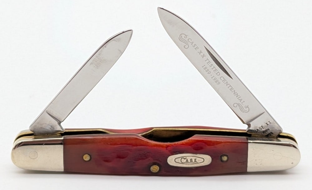 1989 Case XX Centennial Red Bone Eisenhower R62063: Knife is in very nice condition with light scuffs on the bolsters from handling. Overall measures 3-1/8in when closed.