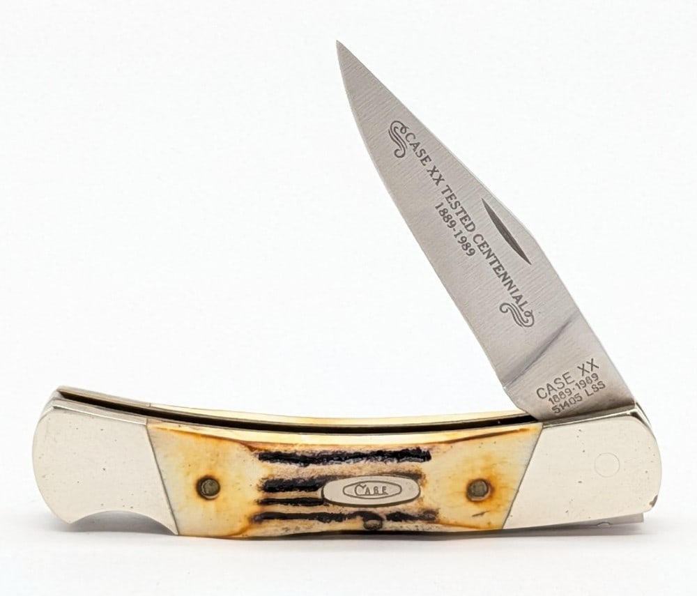 1989 Case XX Centennial Stag Small Caliber Lockback 51405: Knife is in nice condition with some scratches and some tarnishing on the bolsters from handling. Overall measures 3-3/4in when closed.