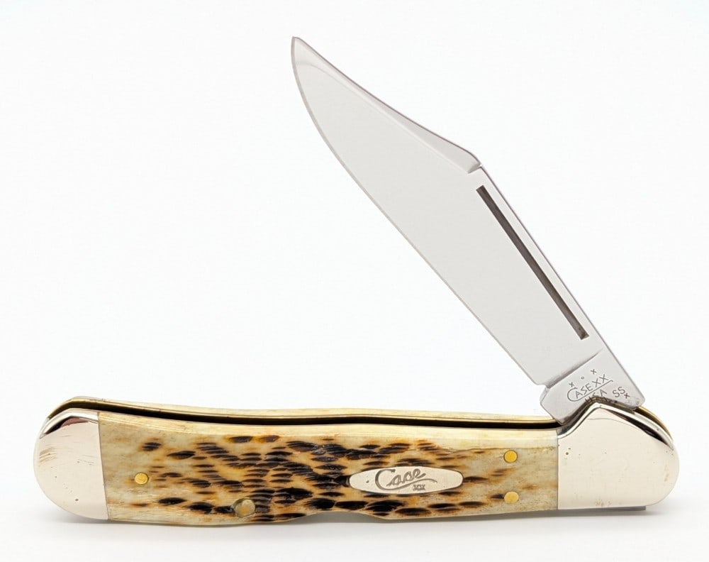 2003 Case XX Amber Bone Long Pull Copperlock 61549: Knife is numbered 018, and is in very nice condition with minimal scuffs from handling. Overall measures 4-1/4in when closed.