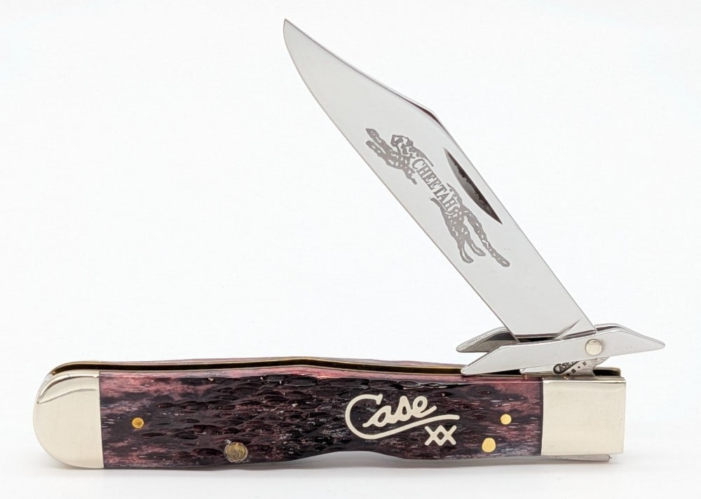 2002 Case XX Silver Script Cranberry Kentucky Concrete Cheetah 6111 1/2: Knife is etched on the back of the blade with the company Kentucky Concrete. Knife is in very nice condition with light scuffs on the bolsters from handling. Overall measures 4-3/8in when closed.