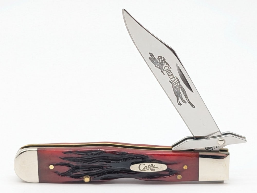2002 Case XX Worm Groove Jig Red Bone Cheetah 6111 1/2: Knife is in very nice condition with light scuffs on the bolsters from handling. Overall measures 4-3/8in when closed.