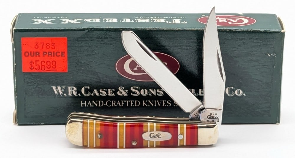 2004 Case XX Candy Stripe Celluloid Tiny Trapper R2154 w/ Box: Knife in very nice condition with minimal wear from handling. Overall measures 2-3/8in when closed.