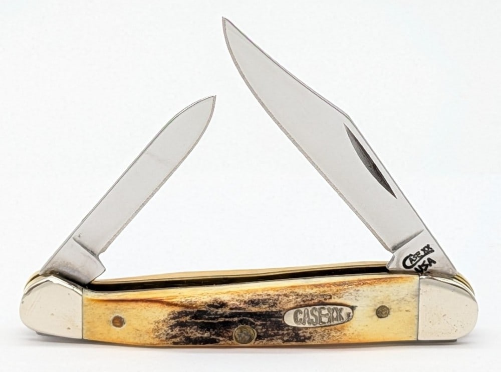 1999 Case XX Stag Mini Copperhead 52109X: Knife is in very nice condition with light scuffs on the bolsters from handling. Overall measures 3-1/8in when closed.