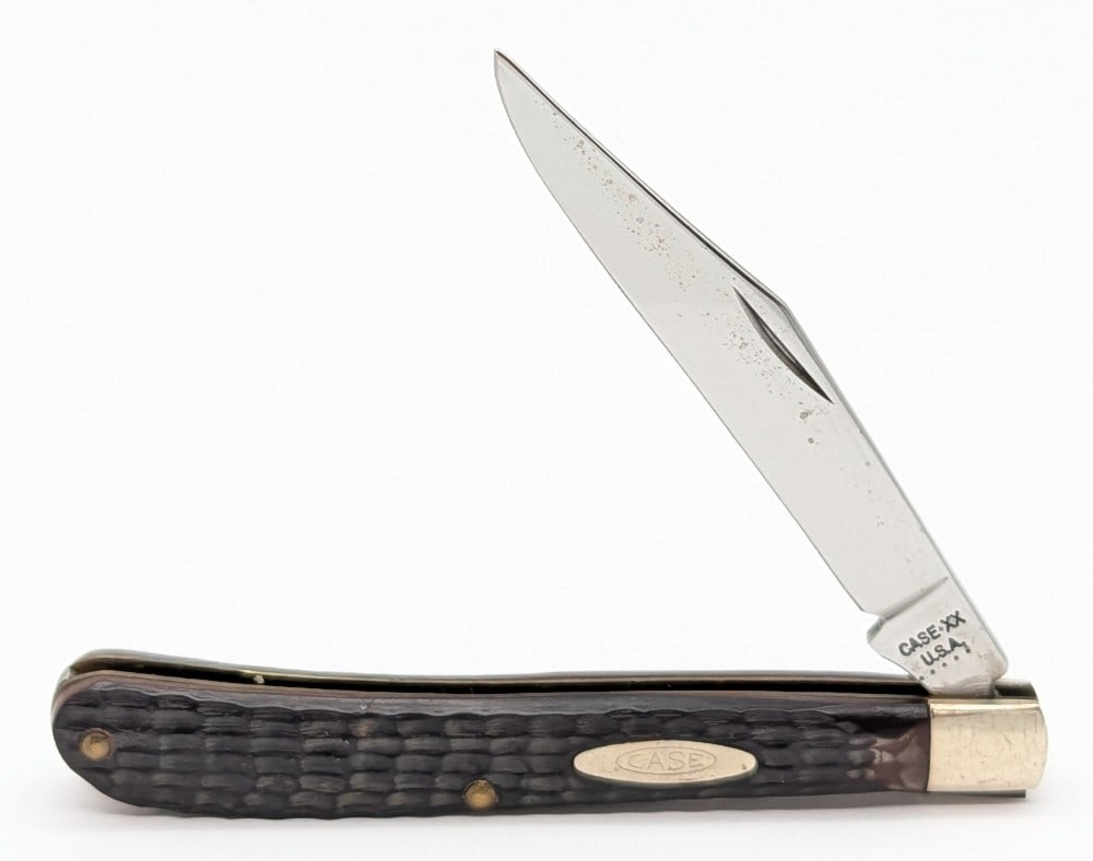 1975 Case XX Delrin Slimline Trapper 61048: Knife is in nice condition with some carbon spots on the blade, and light scuffs on the bolsters from handling. Overall measures 4-1/8in when closed.