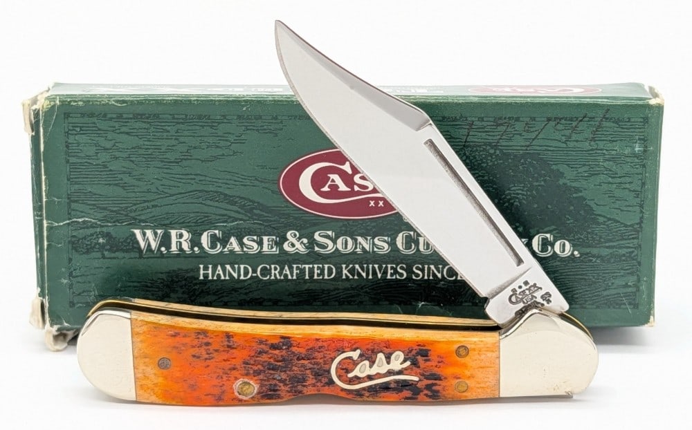 2002 Case XX Silver Script Autumn Bone Copperlock 61749L w/ Box: Knife is in very nice condition with a ding on the upper front bolster. Overall measures 3-5/8in when closed.