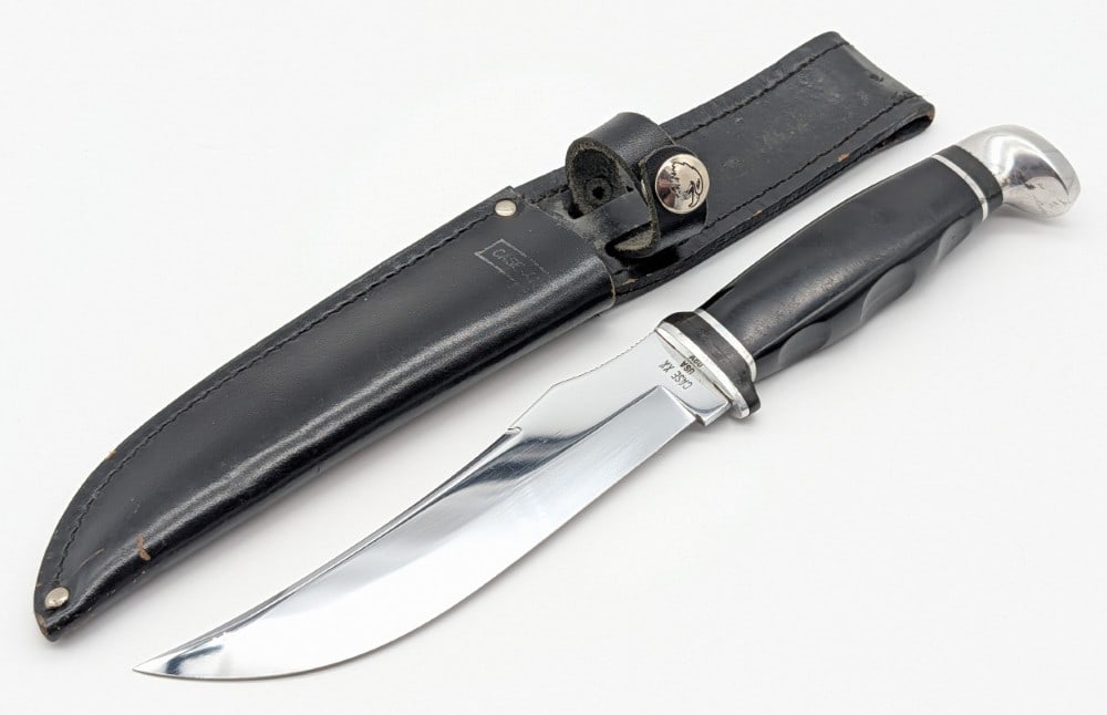 1965-80 Case XX 223-6 Slick Black Hunting Knife w/ Sheath: Knife is in nice condition with light scuffs on the blade, and scuffs and dings on the handle and pommel. Blade length measures 5-3/4in and overall 10-1/2in.