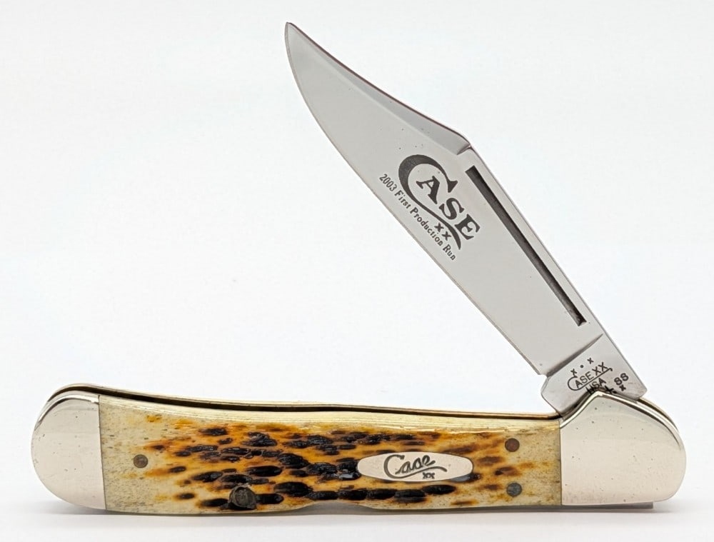 2003 Case XX 1st Production Run Amber Bone Copperlock 61549L: Knife is in good condition with some light scuffs, dings, and tarnishing on the bolsters from handling. Overall measures 4-1/4in when closed.