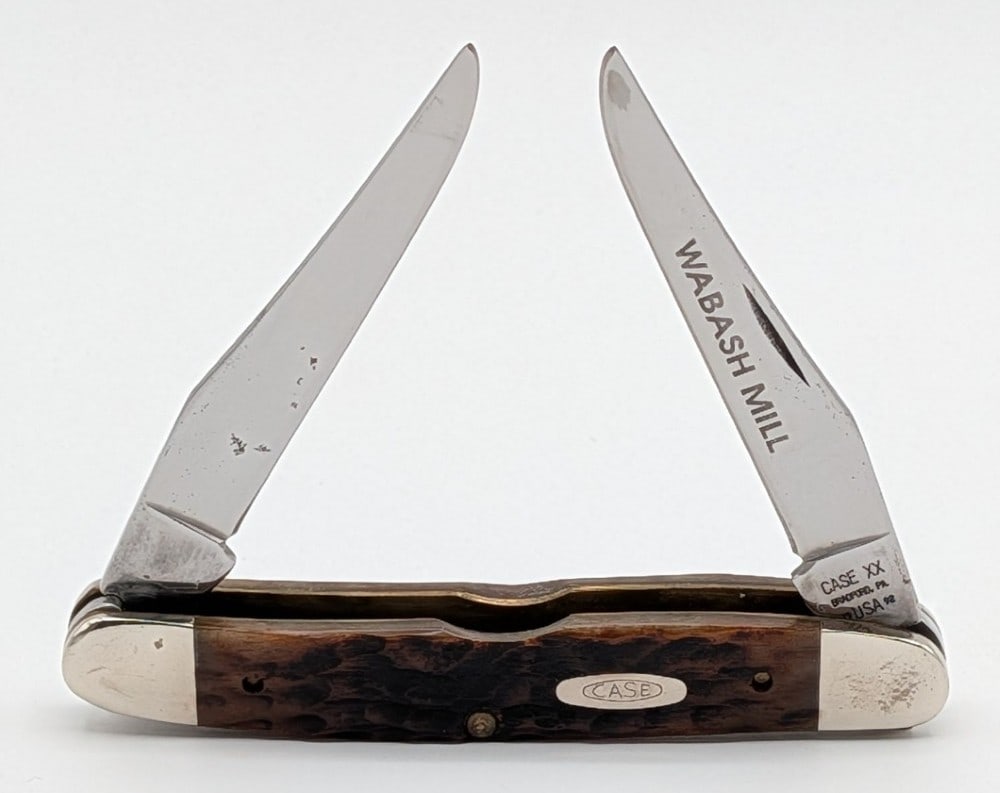 1992 Case XX Wabash Mill Jigged Bone Muskrat: Knife is in nice condition with some sticker residue on the second blade, and scuffs and tarnishing on the bolsters from handling and age. Overall measures 3-7/8in when closed.