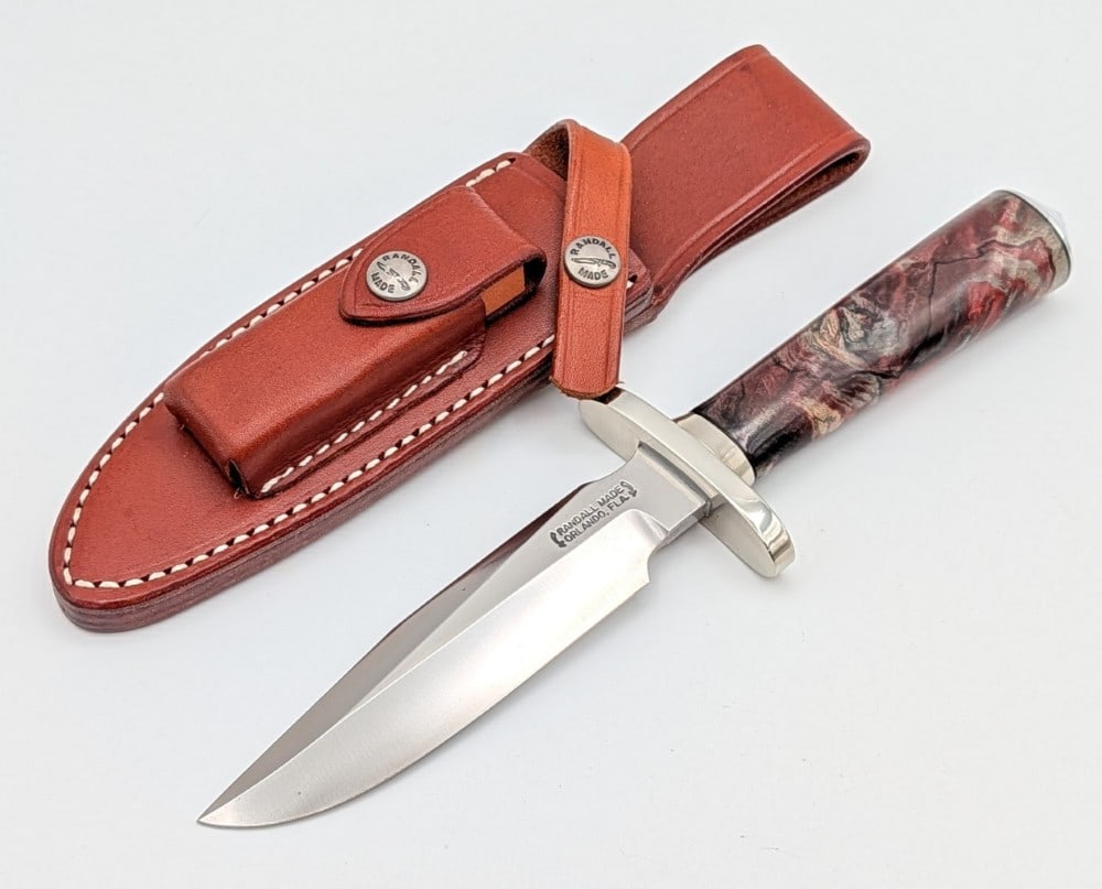 Custom Randall Model 1 5C 5in All Purpose Fighter w/ Sheath: Features a nickel silver oblong upturned double guard, a nickel silver collar, a green dyed walnut handle, and a duralumin coolie cap. Knife is in like new condition. Blade length measures 5in and ove