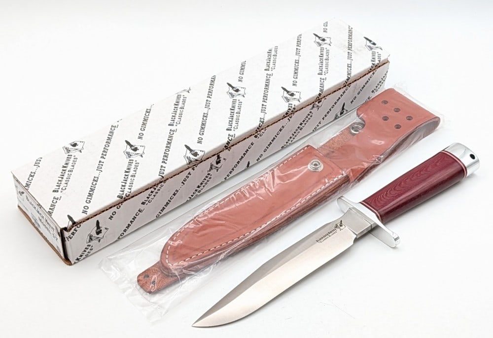 Blackjack Knives Model 1-7 Classic Hunter Randall Style Knife w/ Sheath & Box: Features a Randall style satin finish blade, a polished steel double guard, a red linen micarta handle, a polished steel butt cap with a lanyard hole, and a nut pommel. Knife is in new condition. Blad