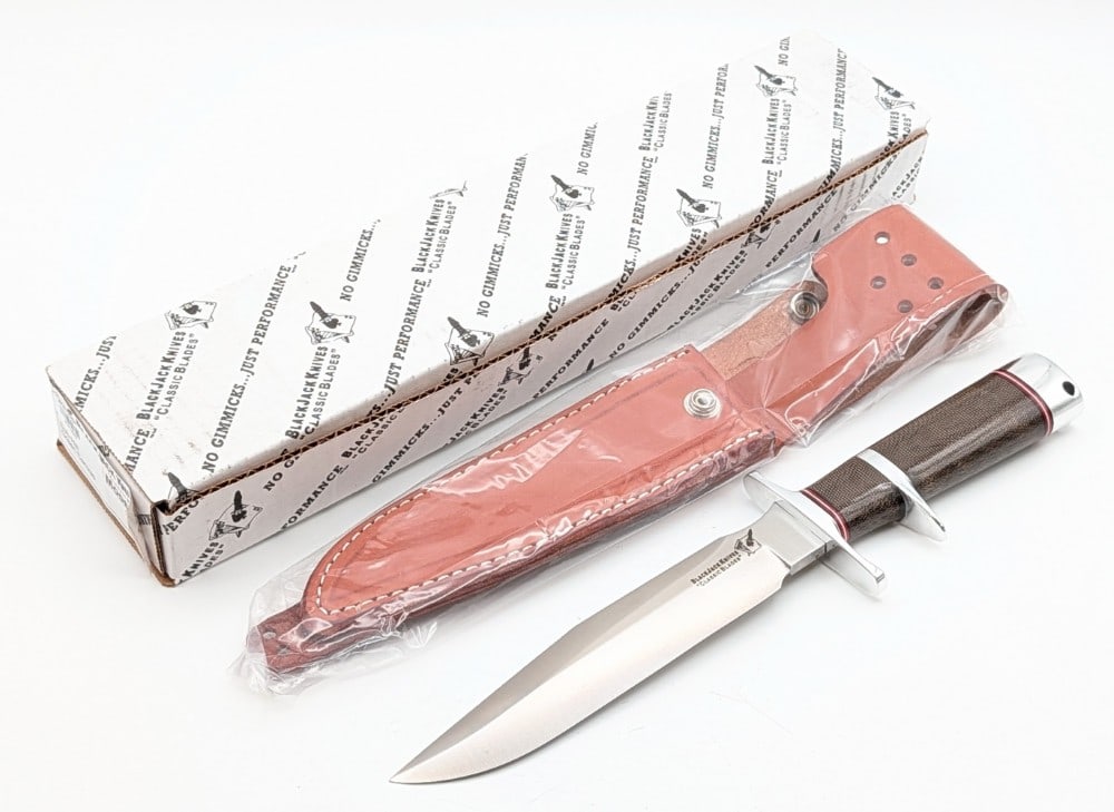 Blackjack Knives Model 1-7 Sub Hilt Fighter Randall Style Knife w/ Sheath & Box: Features a Randall style satin finish blade, a polished steel double guard and sub hilt, a green canvas micarta handle, a polished steel butt cap with a lanyard hole, and a nut pommel. Knife is in new