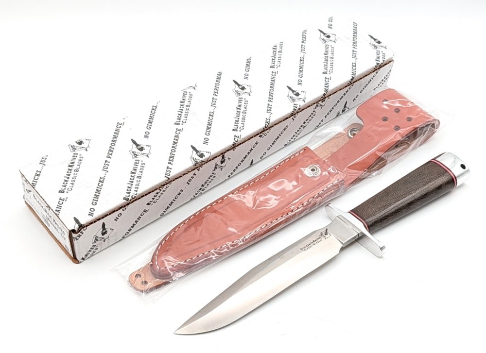 Blackjack Knives Model 1-7 Classic Hunter Randall Style Knife w/ Sheath & Box: Features a Randall style satin finish blade, a polished steel double guard, a green canvas micarta handle, a polished steel butt cap with a lanyard hole, and a nut pommel. Knife is in new condition. B