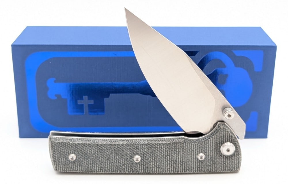 NIB Chaves Ultramar Scapegoat Folding Knife: Features a stonewash finish blade with satin finish grinds, stonewash finish stainless steel liners, and canvas micarta handle scales. Comes in the box with the iconic skull pocket clip. Knife is in
