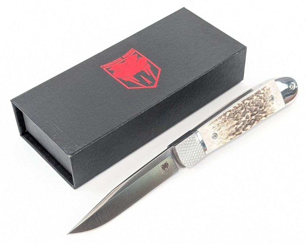 NIB Cobra Tec Stag Hidden Release Trapper Switchblade: Knife is in new condition. Overall measures 4-1/8in when closed.