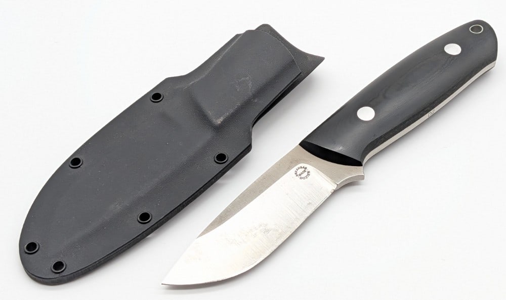 Dozier Knives KS-1 Black Micarta Master Skinner w/ Sheath: Knife is in nice condition with some tarnishing spots on the blade from storage. Blade length measures 3-1/2in and overall 8-1/8in.