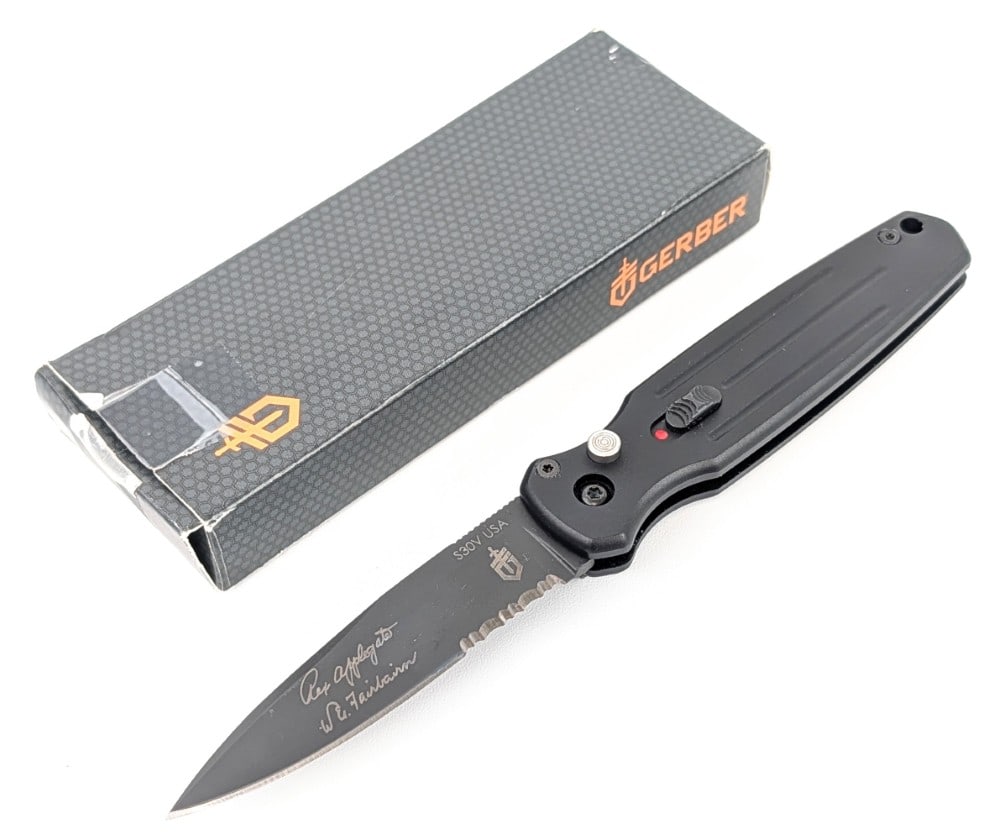 Gerber Applegate-Fairbairn Mini Covert Auto Switchblade Knife w/ Box: Features a black finish partially serrated blade, and a black aluminum handle. Knife is in like new condition. Overall measures 3-3/4in when closed.