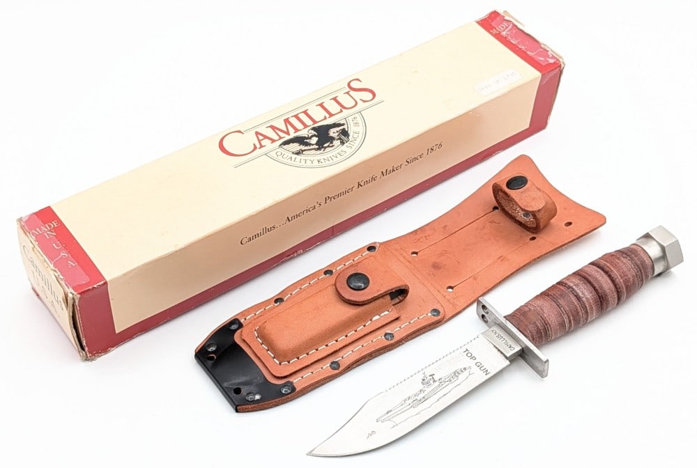 Ltd Camillus Top Gun Pilot Survival Knife w/ Sheath & Box: Knife is numbered 0683 of 1500, and features etchings of the names and image of ships from WWII. Knife is in like new condition. Blade length measures 5in and overall 9-5/8in.