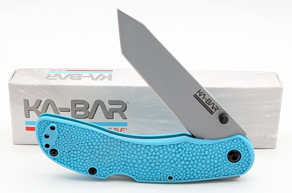 NIB Ka-Bar Space Force Corser Folding Knife: Features a gray powder coat finish blade, and blue plastic handle scales. Knife is in new condition. Overall measures 4-1/2in when closed.