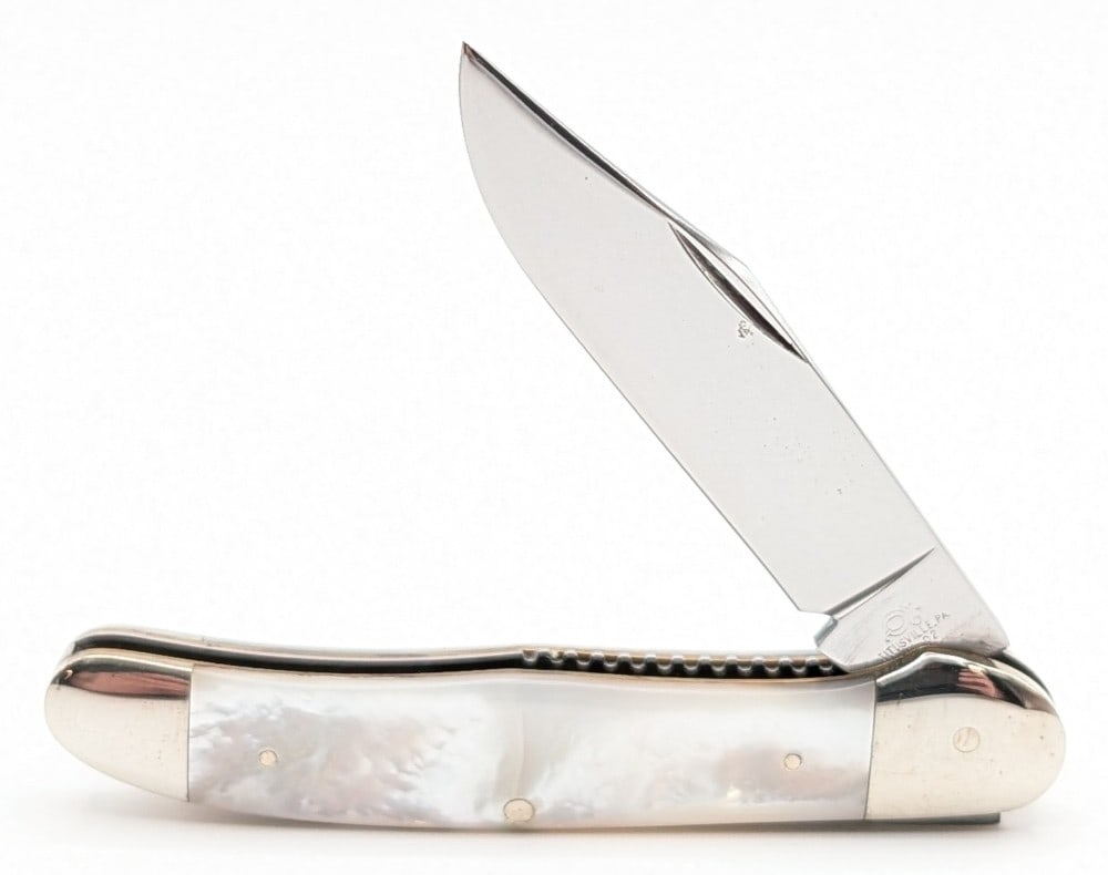 Queen Cutlery Mother of Pearl Liner Lock Folding Knife: Knife is in good condition with some carbon spots and the etching polished off of the blade, light scuffs and tarnishing on the bolsters, and the front handle scale has a crack through the center. Ove
