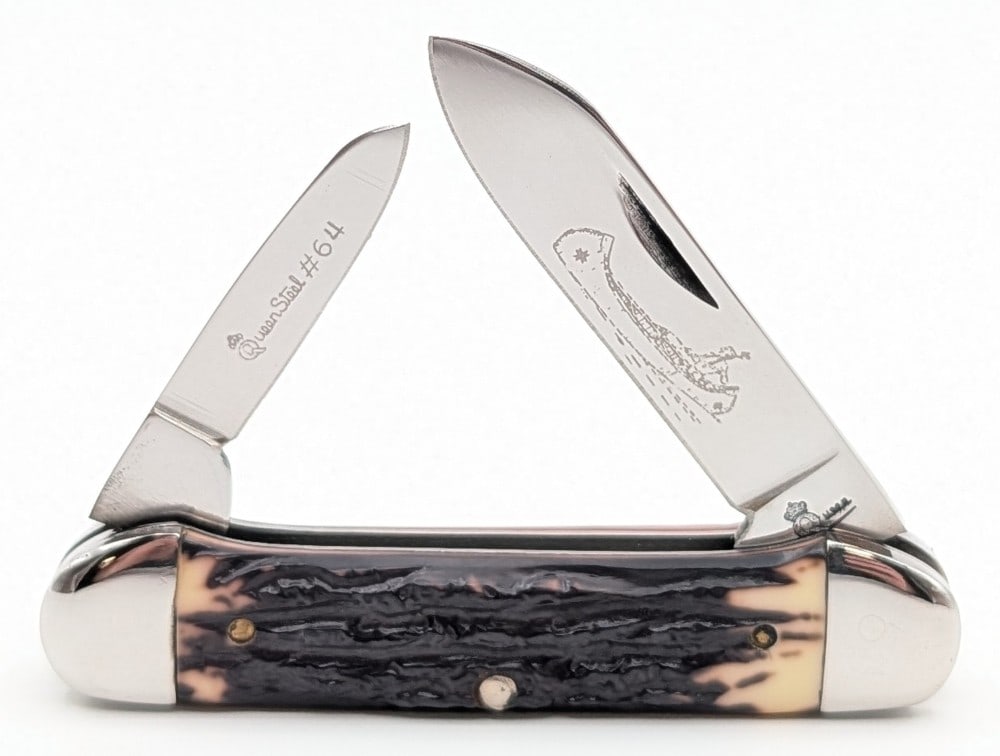 Queen Cutlery Co. Jigged Delrin Canoe Knife #64: Knife is in very nice condition with light scuffs on the bolsters from handling. Overall measures 3-5/8in when closed.