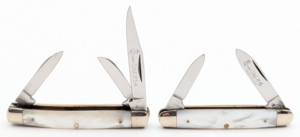 Queen Cutlery Co. Mother of Pearl #54 Small Stockman & #6 Pen Knife: Knives are in good condition with light scuffs and tarnishing on the bolsters from handling and age. The pen knife has a large crack on the back handle scale. Largest overall measures 2-5/8in when clo