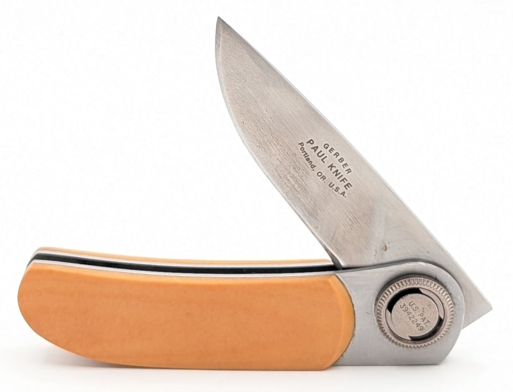 Gerber Model 2 Yellow Micarta Paul Knife: Knife is in good condition with some scratches and tarnishing. Overall measures 3-5/8in when closed.